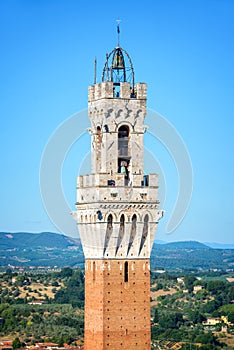 Close up of Torre del Mangia Mangia tower in Siena, Tuscany Italy