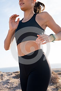 Close up of a torso of a woman running