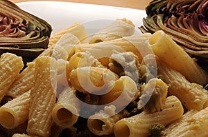 Close up on tortiglioni with artichoke and pea sauce