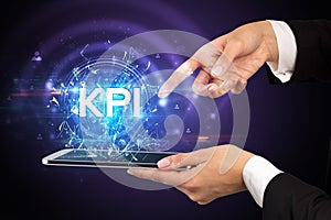 Close-up of a touchscreen with abbreviation.