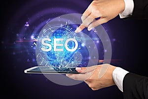 Close-up of a touchscreen with abbreviation.