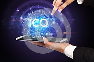 Close-up of a touchscreen with abbreviation.