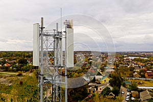 Close-up of tower with 5G and 4G cellular network antenna. Aerial view