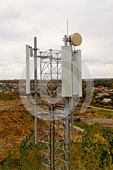 Close-up of tower with 5G and 4G cellular network antenna. Aerial view