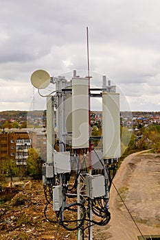 Close-up of tower with 5G and 4G cellular network antenna. Aerial view