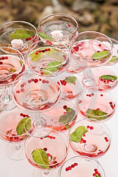 Close up tower of glasses with creative champagne on table in selective focus. aperitif at wedding party