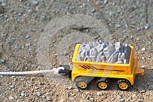 Close up of toy car on the ground.