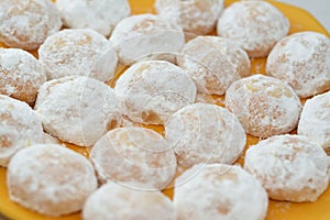 A close up of traditional Arabic cookies for celebration of Islamic holidays of El-Fitr feast, Egyptian Kahk covered with sugar photo