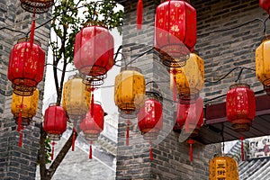 Close-up of traditional blessing lanterns in ancient Chinese architecture. Translation: Happy New Year.