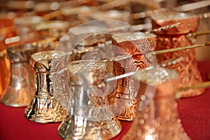 Close-up on traditional bosnian copper coffee pots in Kazandziluk street