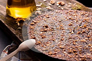 Close up of traditional castagnaccio cake, a classic italian gluten free autumn cake on wooden table made with chestnuts flour,