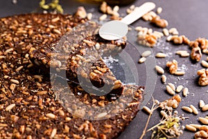 Close up of traditional castagnaccio cake slice, a classic italian gluten free autumn cake on wooden table made with chestnuts