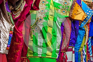 Close up of traditional colorful embroidered indian sarees