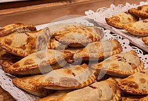 Close up of traditional fried Spanish and Argentine empanadas at a street food market in spain