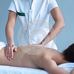 Close-up of traditional healing and recreation massaging treatments. Health, skin care, massage, osteopathy and manual