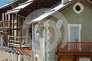 Close-up on traditional houses with traditional wooden balconies in Saint Veran village