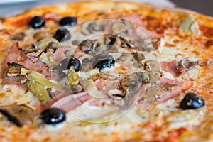 Close-up for traditional italian pizza Capricciosa.