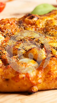 Close-up Traditional Italian pizza. Traditional food from Palermo, Sicily, Italy. Ingredients Tomato sauce, anchovy, onion, cheese