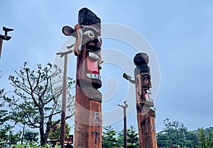 Close-up of a traditional male and female Korean totem pole at the Northern Sky Skyway in Seoul, South Korea