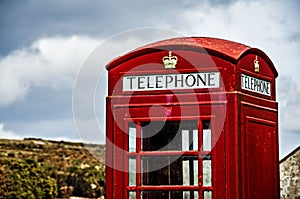 Close up of a traditional red English telephone booth