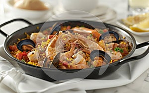 A close-up of a traditional Spanish paella dish filled with shrimp, mussels, and saffron rice.