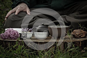 Close-up of traditional tea set for tea ceremony with clay pot and bawls