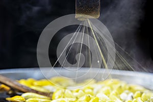 Close up of Traditional Thai silk in roll, cocoon of silk golden worm. Golden worm cocoon were boiled for threshing or rubdown