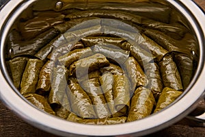 Close up traditional Turkish, Middle Eastern and Balkan Dolma, Sarma or Dolmades in saucepan