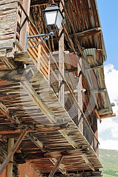 Close-up on a traditional wooden house with its traditional balcony in Saint Veran village photo