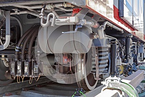 Close up train stop gear with steam locomotive detail, cranks, wheels and braking system with energy transmission.