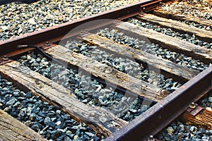 Close-up of train tracks, steel rails and wooden sleepers