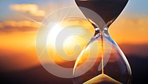 Close-up of a Transparent Hourglass with Blurry Sky at Sunset or Sunrise - Generative Ai