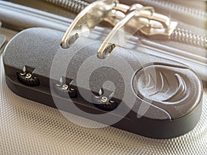 Close up travel bag with zipping number code locked. close-up of silver suitcase number code lock. Summer holiday travel concept