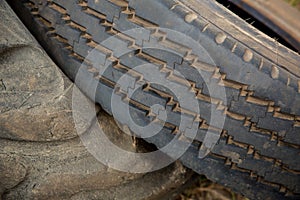 Close up tread of old tire. unused dirty tire. Toxic waste disposal concept. reuse the rubber concept.