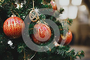 Close-up tree decorated with orange balls