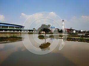 Close up trees in the middle a river left side a building at Sekayu city South sumatera - Indonesia, 06/29/2020