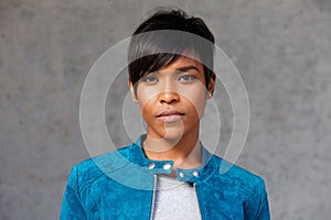 Close up trendy young black woman with blue jacket