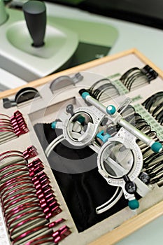 Close-up trial frame glasses and set of lenses to examine eye visual system of patient with short or long power vision.
