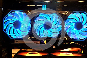 Close-up triple cooling fans on industrial high performance computer graphic card