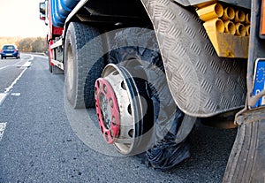 Close up of a truck with burst tyre