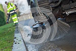 Close up truck cleaning street