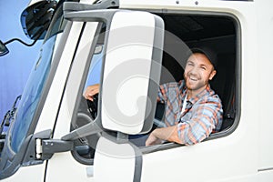 Close up of truck driver behind steering wheel. Copy space.