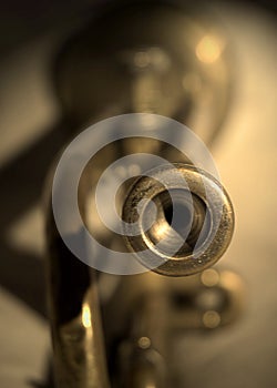 Trumpet mouthpiece close-up in golden light