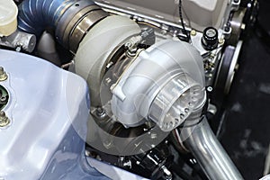 Close-up turbo engine on car bonnet for modify and tune up speed