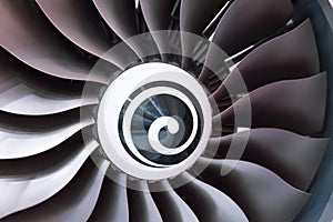 Close up of a turbofan turbine blades jet engine in modern airplane warm shade light