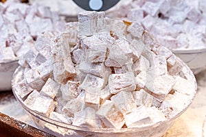 Close up of Turkish delight sweet treat with powdered sugar at Mahane Yehuda Market in Jerusalem