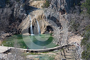 Close-up Turner Falls with people visiting on Honey Creek in the Arbuckle Mountains of south-central Oklahoma