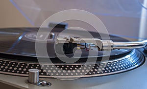 Close up of a turntable needle head