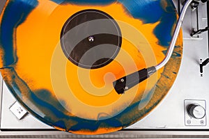 Close up of turntable needle on a vinyl