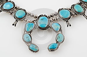 Close Up of Turquoise Squash Blossom Necklace.